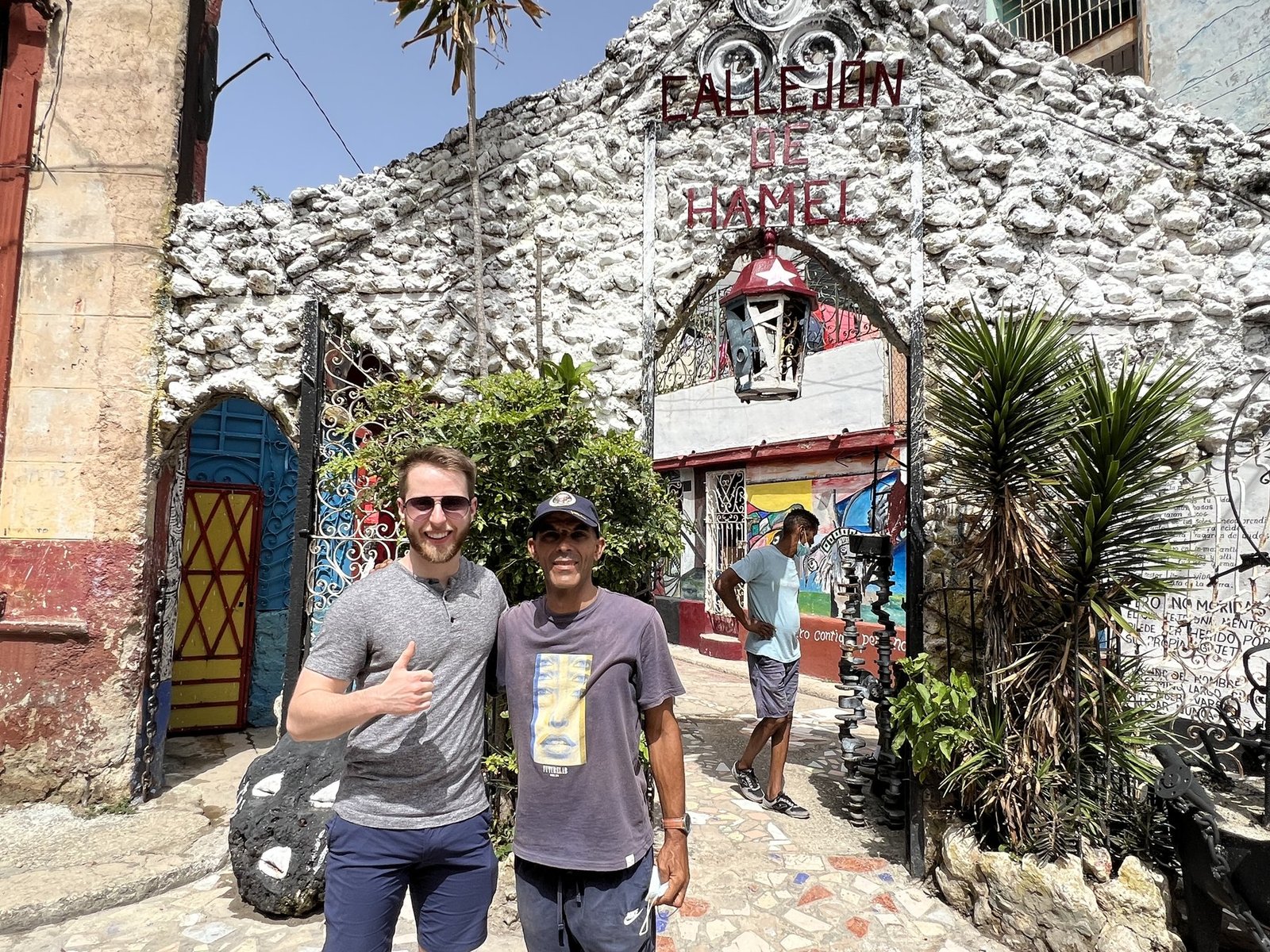 Camino Atlas founder Patrick Flaherty with a local guide at the entrance to Callejon de Hamel, Havana